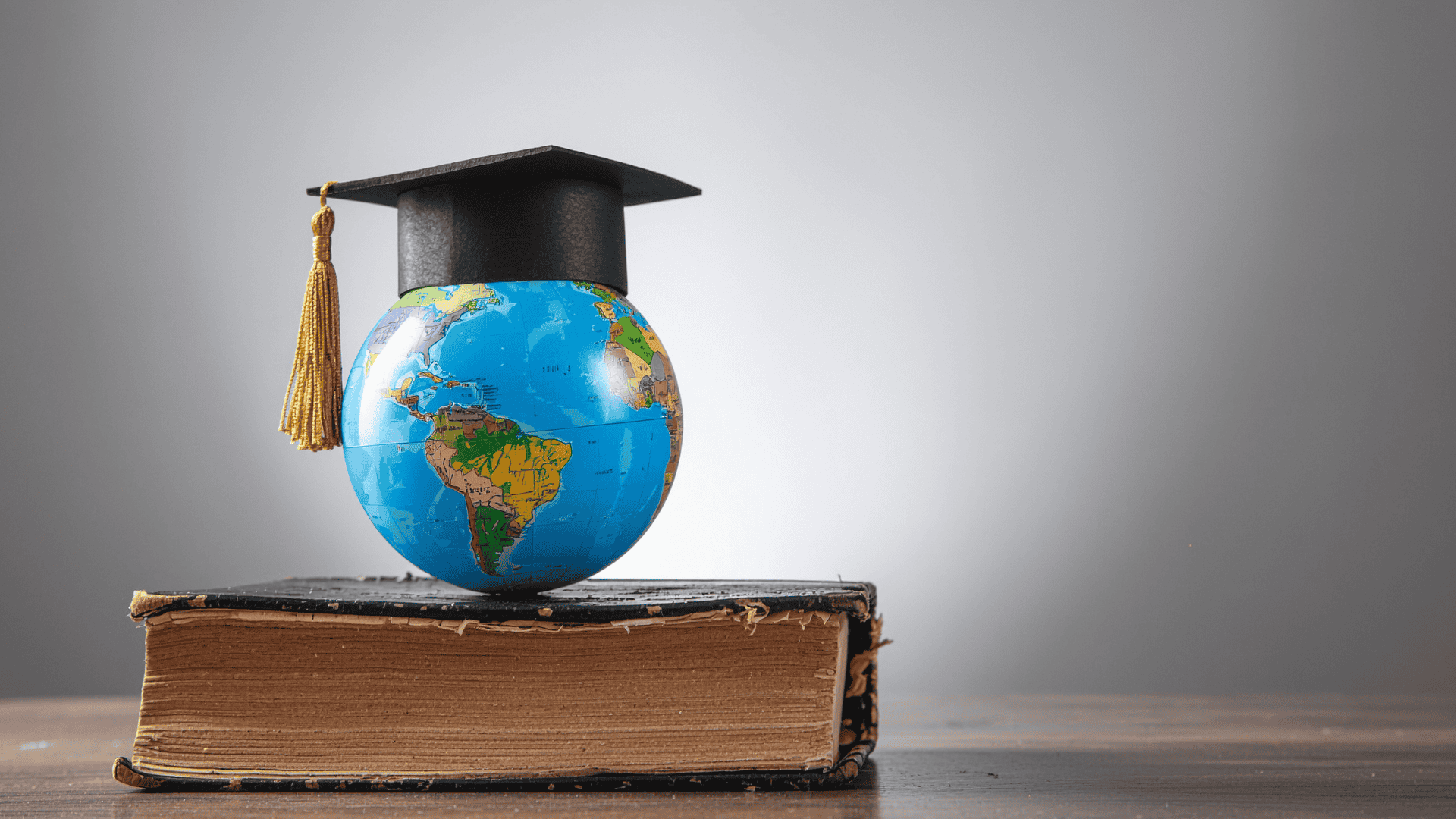 graduate cap above globe